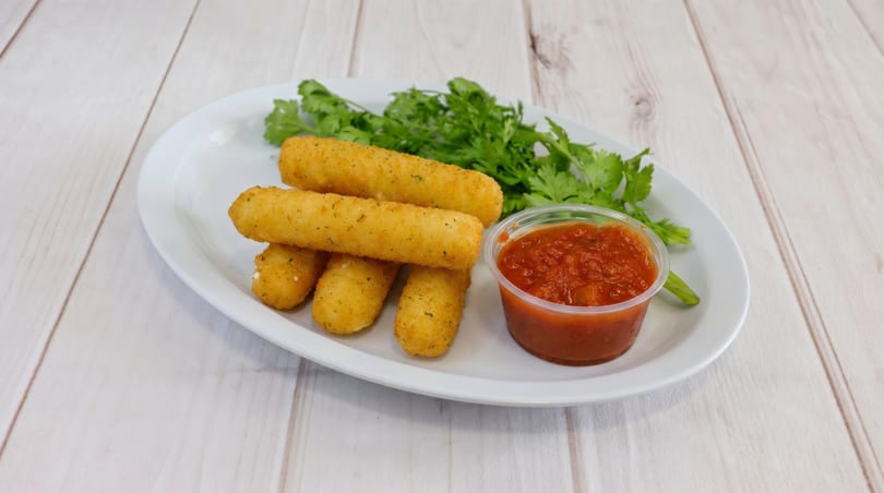 Golden-brown mozzarella sticks with a side of red marinara sauce and green garnish on a white plate.